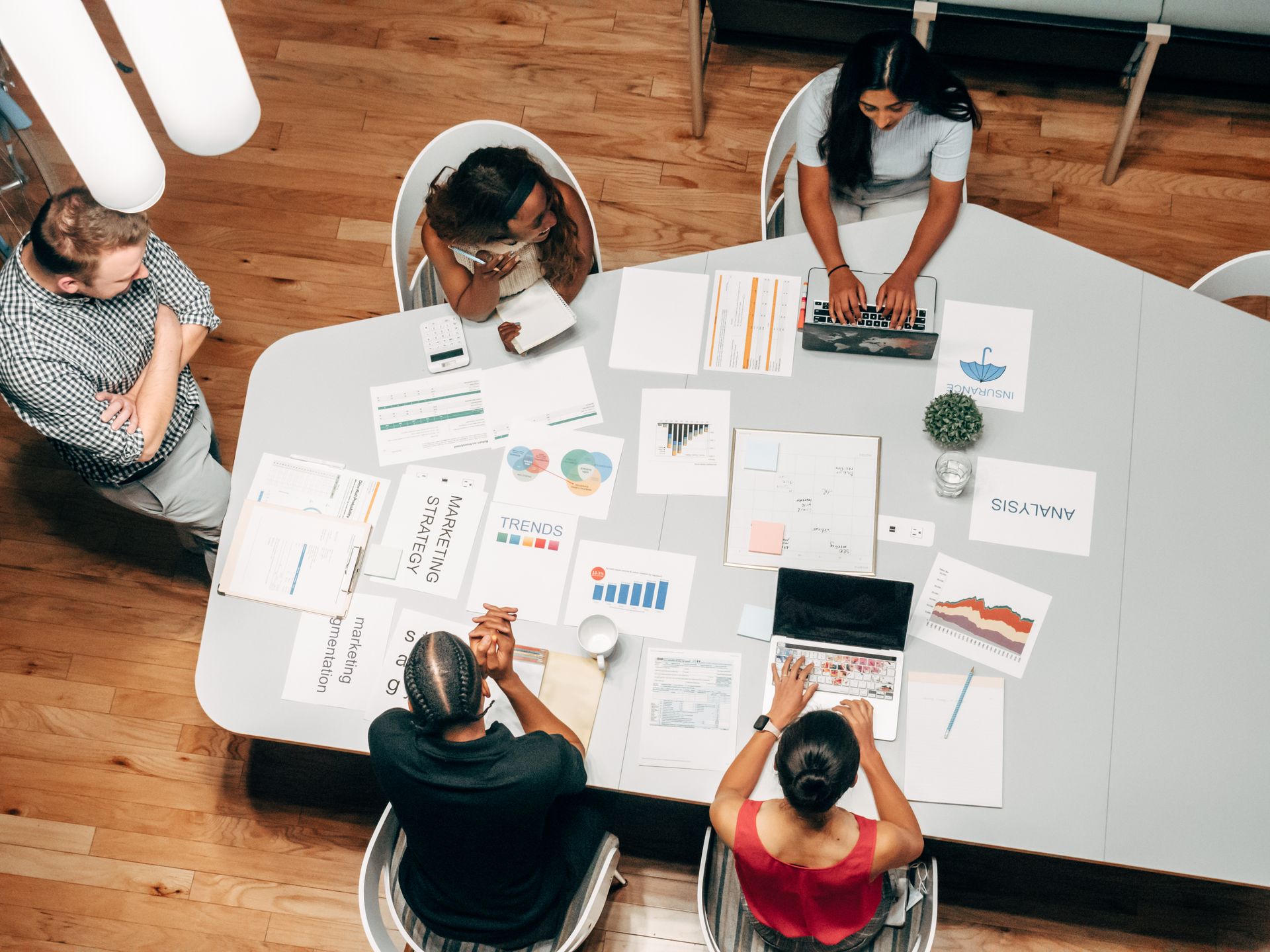 Creative team reviewing ad variants before launch